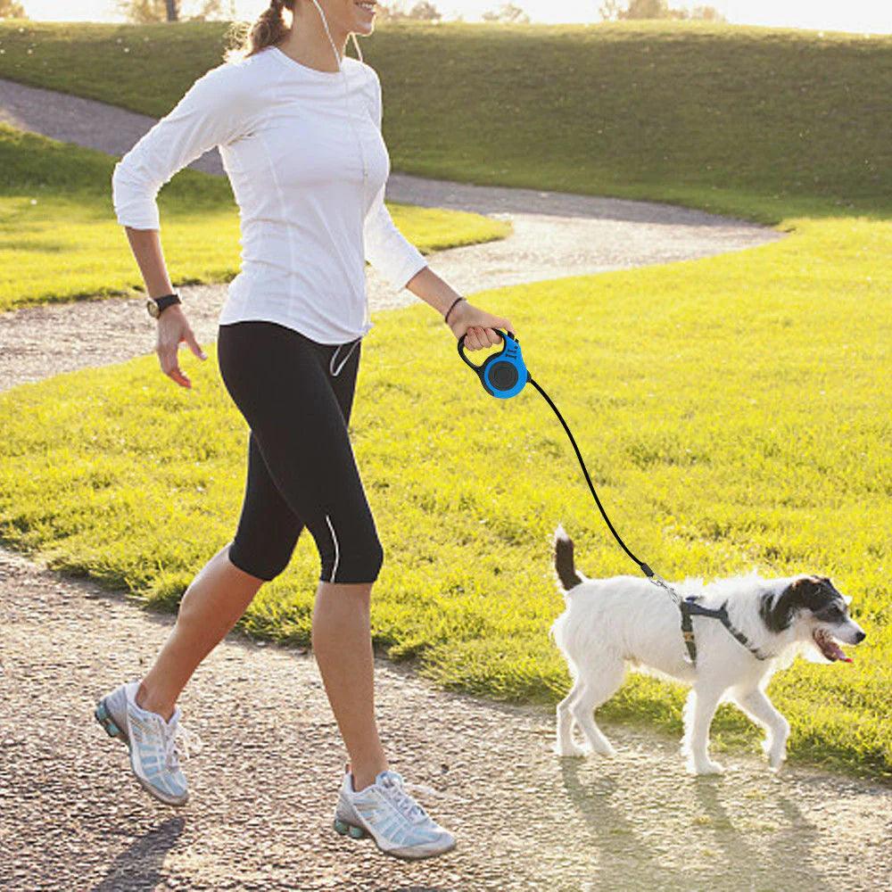 .A person using the one-touch brake and lock safety system on the retractable dog leash.