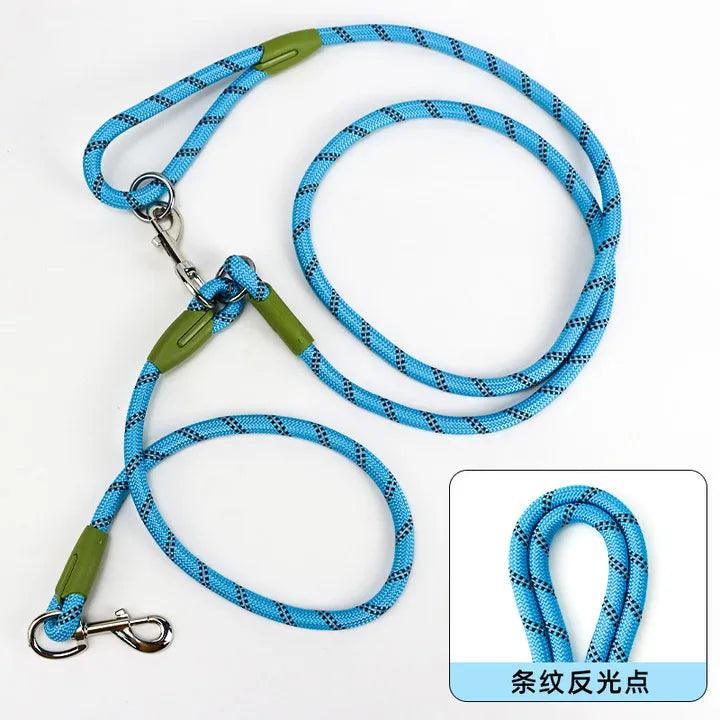 Person holding a padded handle of a reflective nylon dog leash.