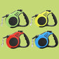 Multiple retractable leashes of different colors, ideal for walking multiple dogs.